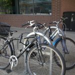 Bikes locked to outdoor bike lock outside ADM building